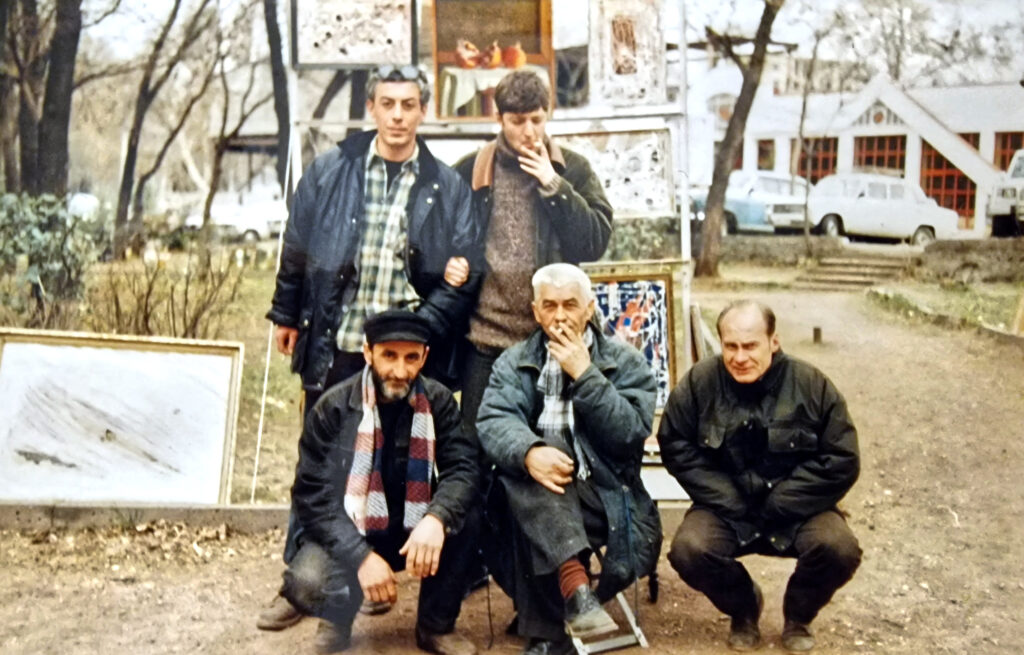 Hans Heiner Buhr with Otar Chkhartishvili and friends at the Dry Bridge art market in Tbilisi, 1998.