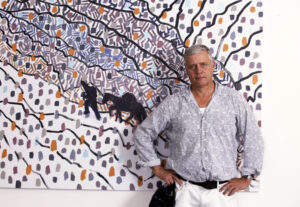 Hans Heiner Buhr standing in front of his painting Atsunta Pass at Vernissage Gallery Tbilisi, June 2026